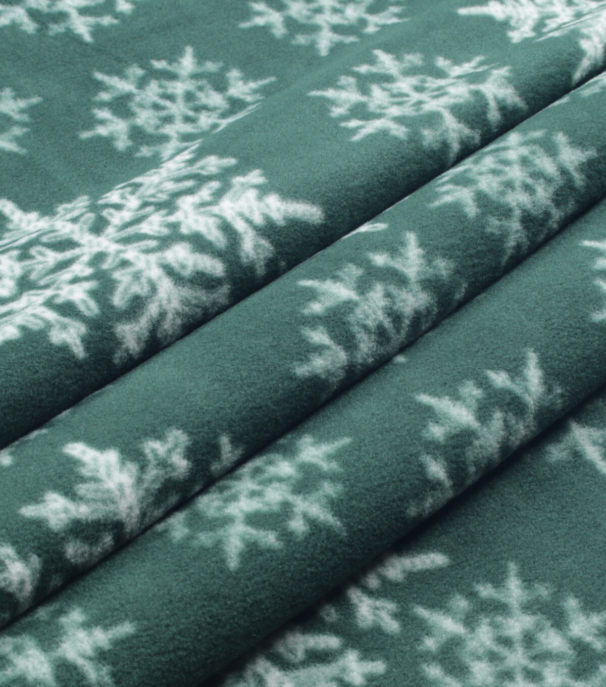 White Snowflakes on Green Anti Pill Fleece Fabric